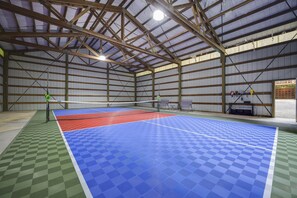 Bring everyone together in your private indoor Pickleball court! Complete with sports court, nets for volleyball or badminton, racquets and balls, and team benches!