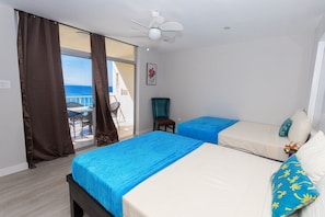 2 Comfortable Full-size beds with ocean view