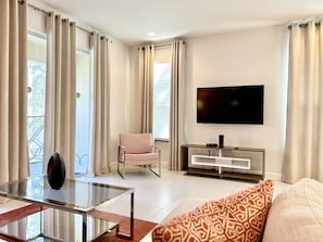 Cozy integrated living room with Smart TV, seen from another angle.
