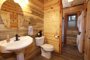 Main floor bathroom, with stackable washer and dryer.