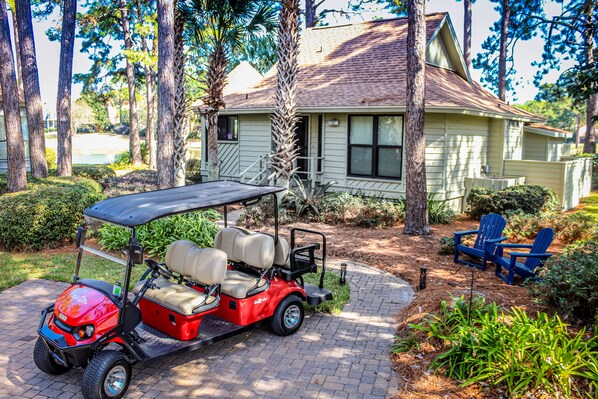 Seas the Bay with 6-Seater Golf Cart on quiet street with stunning views