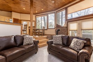 Leather Sofas in the Bright Living Space with Tongue and Groove Ceilings