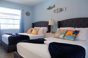 Master Bedroom with two double beds and full bathroom