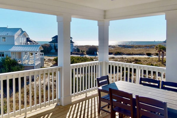 Enjoy the ocean views from the back deck with plenty of seating for a meal or just relaxing