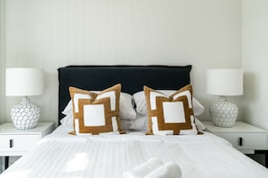 Second bedroom with queen bed opening to the balcony