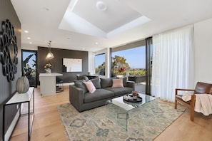 Spacious open plan living room opens to the balcony