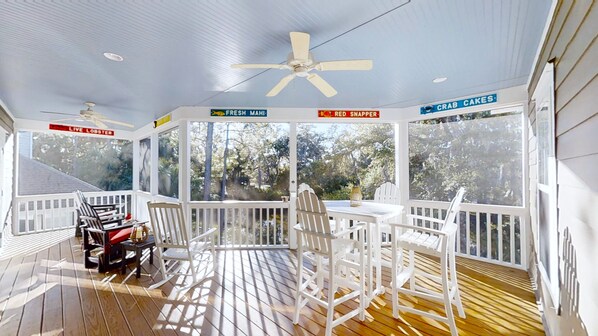 Back screened porch overlooking lagoon.