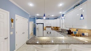 Spacious kitchen with 3 bar seats and plenty of counter space!