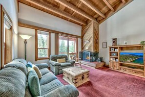 Spacious upstairs living area, wood burning fireplace, deck overlooking meadow.