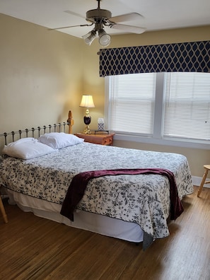 Music room bedroom... queen bed, yahama guitar, two extra chairs