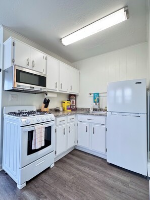 Toaster, pots/pans, dish dry rack, etc are under the cabinets.