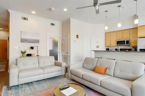 Welcome to our cozy living room! Enjoy a comfortable stay with ample seating.