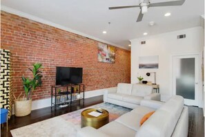 Welcome to our cozy living room! Enjoy a comfortable stay with ample seating.