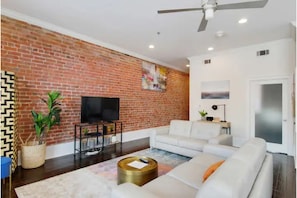 Welcome to our cozy living room! Enjoy a comfortable stay with ample seating.