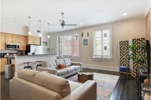 Welcome to our cozy living room! Enjoy a comfortable stay with ample seating.