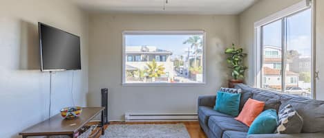 Comfy living room with plenty of San Diego sun light