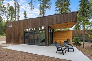 Exterior patio space with Fuego grill, tables, and chairs