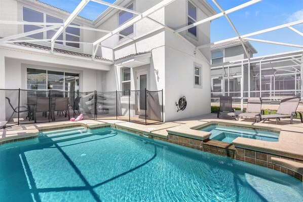 Pool and spa with loungers