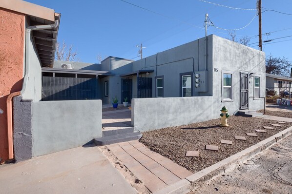 Front of the property with shared courtyard - Unit A entrance on the right  