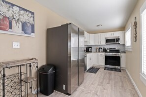 Fully stocked kitchen with stainless steel appliances