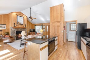 Kitchen with breakfast bar island over looking Living Room