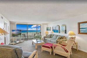 Plenty of seating in this living area that also features a queen size sofa sleeper.