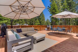 Exterior: Spacious front deck, BBQ, outdoor dining table, outdoor seating area