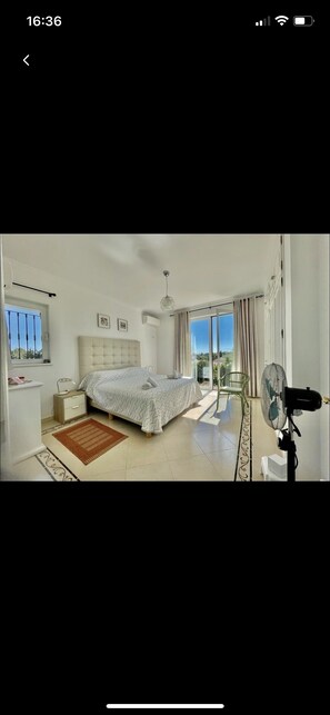 Master bedroom with a balcony and an suite full bathroom 