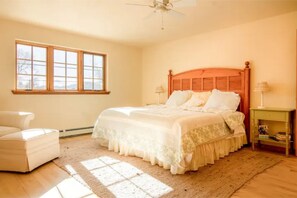 King size bed in spacious upstairs bedroom