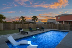 Relax in the one of kind pool with tanning deck/chairs