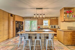 Kitchen w/ Breakfast Bar | Dishware Provided | Main Level