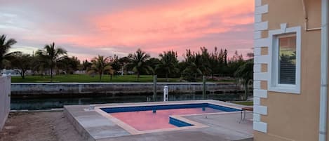 New pool completed Dec 2023. Saltwater with sundeck & bar chairs in the pool.