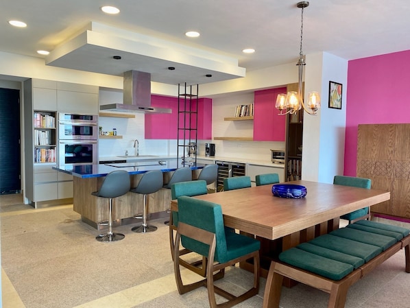 Open kitchen, dining area and living room upon entering the apartment. 