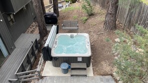 Hot tub with bar mechanism for easy fold and holds out of the way.