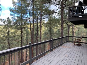 Large main deck overlooking the forest. More seating options available.