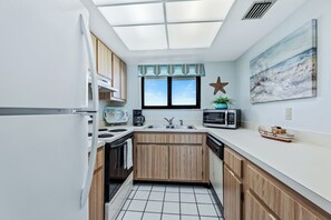 The fully equipped kitchen is ready to handle all your culinary needs, making it easy to prepare homemade meals.