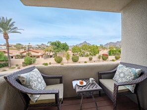 2nd Floor: Primary Bedroom balcony featuring outdoor furnishings complete with neighborhood and mountain views.