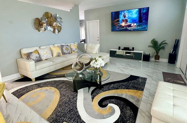 Modern and spacious living room with 75” smart TV to watch your favorite show.