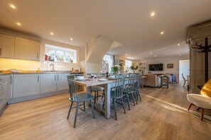 The Coach House, Ringstead: The dining table and bespoke kitchen