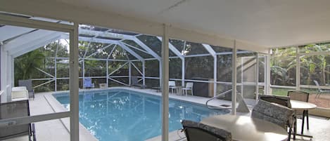 Gazebo with outdoor dining by the pool