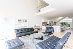 Formal sitting/living area with stylish modern furniture