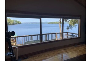 15 feet of windows showcase an amazing view of the lake, island and mountains.