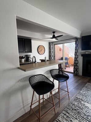 Patio access with outdoor seating and barbeque grill