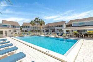 Enjoy a swim in the community pool located just steps away from the rear patio.