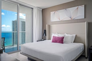 The master bedroom features a super comfy king size bed, a 42" Roku TV, charger outlets on the nightstands, and amazing views