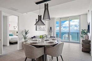 The main living and dining space looks out over the ocean