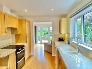 Kitchen with oven, dishwasher, fridge freezer & coffee maker