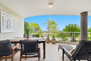 Front balcony with dining table
