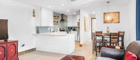 Living Space With Dining Table and Full Kitchen