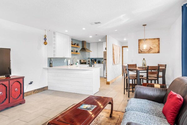 Living Space With Dining Table and Full Kitchen